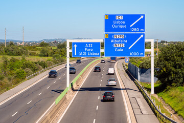 Directional Signs on A22 Highway to destinations in Algarve, Portugal and Portuguese Capital, Lisbon (Lisboa). The A22 is the principal highway in the Algarve. © allard1
