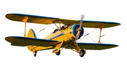 Isolated classic yellow biplane with blue accents, propeller in motion, ready for flight. © Oisin