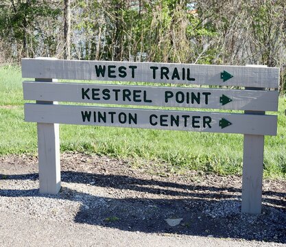 A close view of the old wood trail sign in the park.