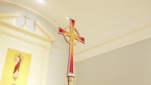 Christian Crucifix with Jesus Christ on the Cross Inside Church with Soft Bokeh Background
