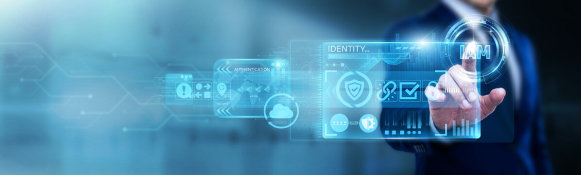 IT Security Lead pointing at IAM (Identity and Access Management) on a digital screen. User authentication, authorization, and digital IDs. Ensuring only the right people access data.
