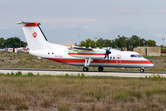 Luqa, Malta - September 25, 2005: Schreiner Airways De Havilland Canada DHC-8-102 Dash 8 (REG: PH-SDH) landing runway 14.