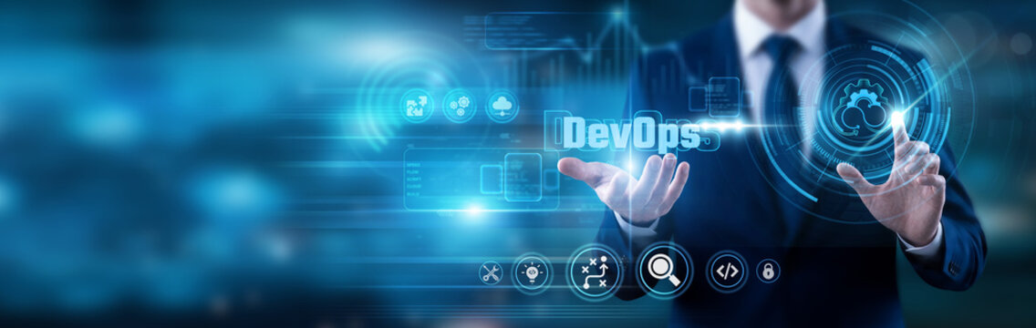 Engineer pointing at DevOps text. Integrating software development and IT operations to shorten the systems development life cycle and provide continuous delivery with high software quality.