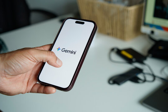 Barcelona, Spain, May 8, 2026. Hand holding smartphone displaying google gemini ai app in Barcelona, Spain