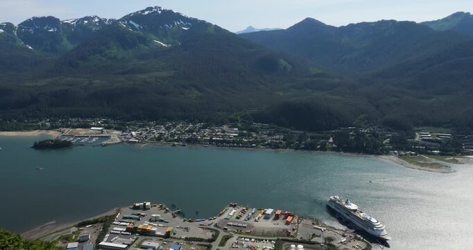 Snow-capped Mount Bradley on Douglas Island and Gastineau Channel, Juneau, Alaska.Cruise ship docked at Juneau Cruise Terminal.