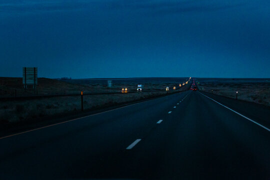 Night driving on Interstate 90, a view of the oncoming traffic.