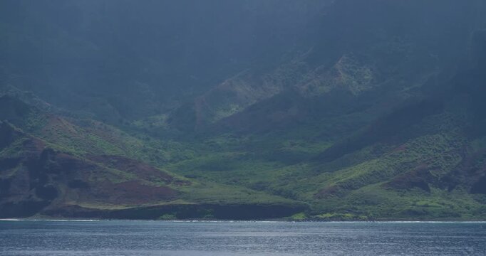 Napali Coast, Hawaii. Amazing natural beautiful landscape of the Napali coastline with emerald-hued cliffs with razor-sharp ridges towering above the Pacific Ocean and deep, narrow valleys.