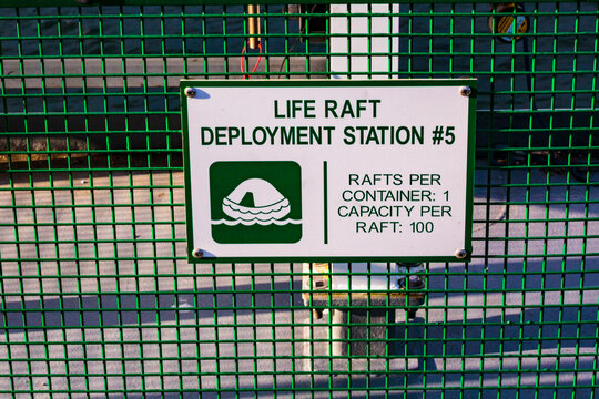 Life raft deployment station sign on a ferry in Seattle, an information sign.