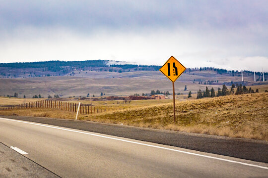 Lane merge sign on near Cle Elum, Interstate 90 and a view across the landscape.