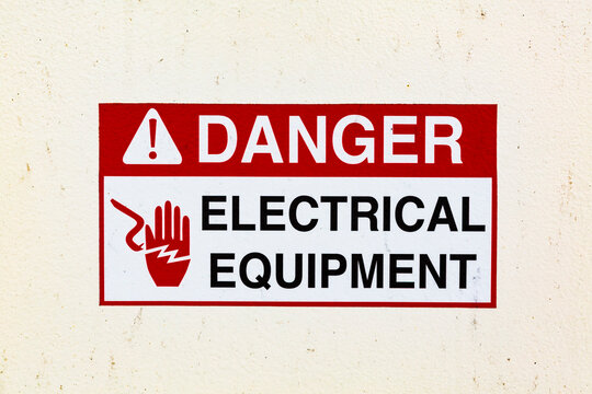 Signs on a ferry warning of electrical equipment. Danger symbol.