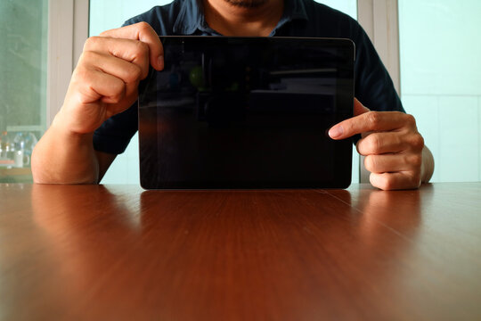 Man Holding Blank Tablet Screen