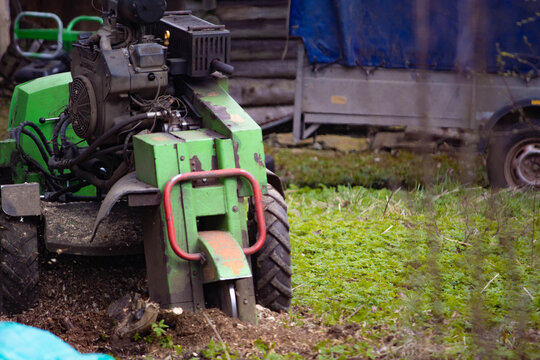 A stump grinder grinds, cuts, and digs up stumps.