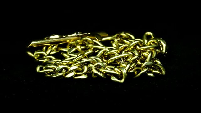 Golden Chain Necklace With Cross Pendant Rotating 360 Degrees on Black Background &ndash; Luxury Jewellery Video