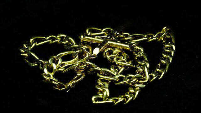 Golden Chain Necklace With Cross Pendant Rotating 360 Degrees on Black Background &ndash; Luxury Jewellery Video