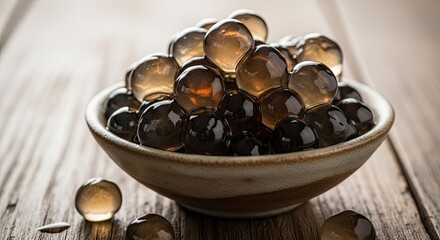 Fototapeta premium Brown gelatin capsules in bowl on table.