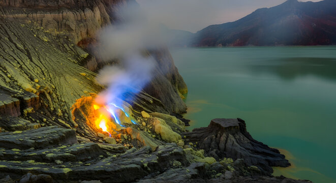 Blue fire and sulfur gas in Kawah Ijen crater