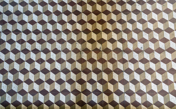 Geometric hydraulic tile mosaic with optical cube pattern and neoclassical republican floor design. 