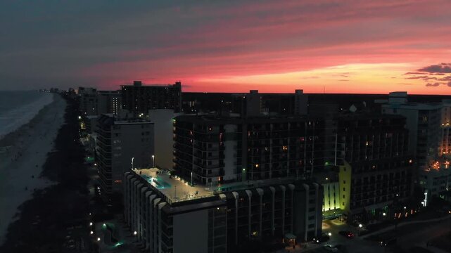 Aerial view of Myrtle Beach coastline and buildings from drone at sunset, South Carolina
