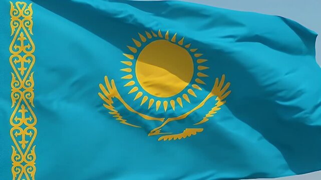 The video showcases the national flag of Kazakhstan, prominently featuring a stylized sun and eagle emblem against a light blue background.
