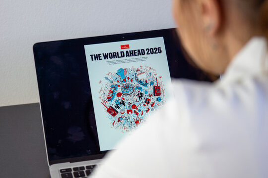 Bratislava, Slovakia, Europe - May 08, 2026: Young woman studies The Economist 2026 magazine cover, trying to decode a hidden hantavirus warning and mysterious global message.