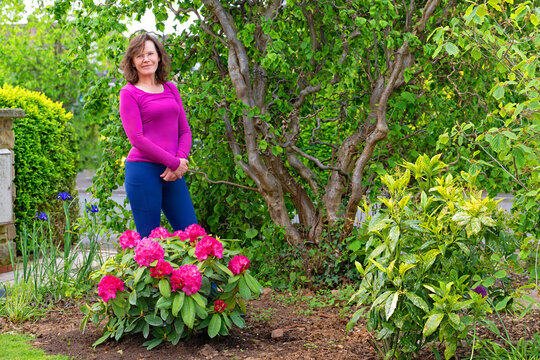 Lady in the May front garden border.
