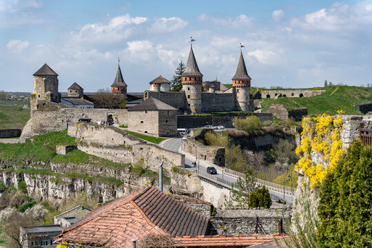 View of Kamianets-Podilskyi Castle with its medieval stone towers, fortified walls and a stone bridge under a blue sky Kamianets-podil's'kyi, Khmel'nyts'ka oblast, Ukraine.