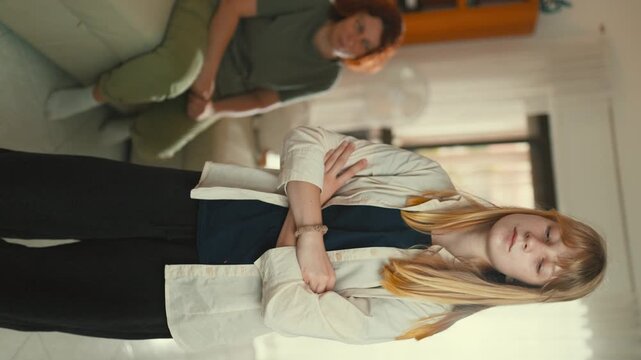Frustrated teenage girl having a conflict with her mother at home
