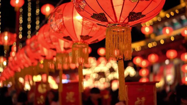 Traditional chinese red lanterns hanging in a row during night festival
