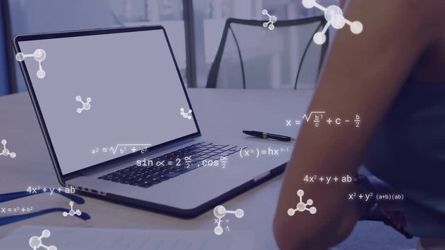 Woman leaning to laptop, causing molecules and equations to drift across laptop and arm for science