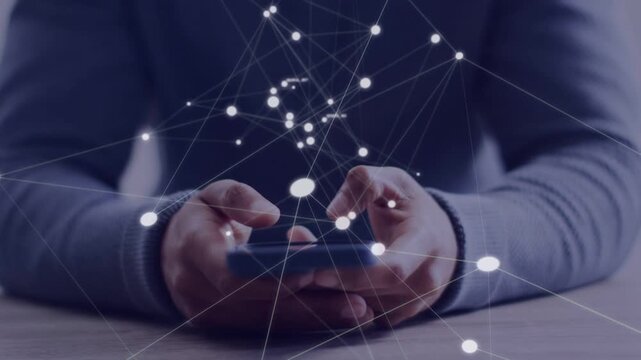 Man tapping smartphone on table in technology demo, animated node network growing above device