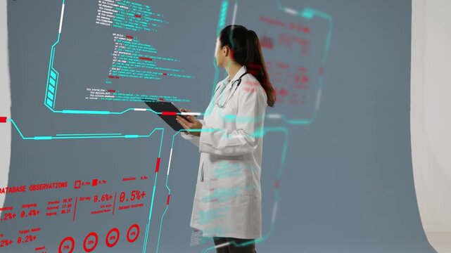 Female doctor studying medical AR UI, tapping tablet, updating data panels and verifying records