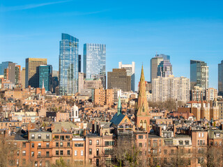 Fototapeta premium Boston skyline rising above historic brownstone neighborhoods