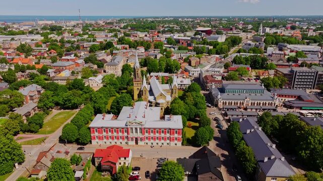 Drone turning right over Liepaja Latvia revealing church and council building