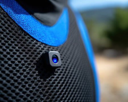 Digital camera sensor black mesh fabric with blue trim highlights industrial design and promotes digital literacy wearable technology innovation
