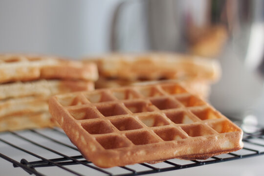 Close-up of Fresh waffles on a metal cooling rack