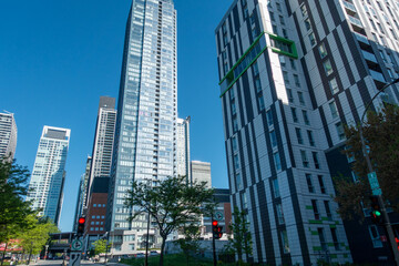 Naklejka premium One Bloor East Toronto Skyscraper with Modern High Rise Buildings and Blue Sky