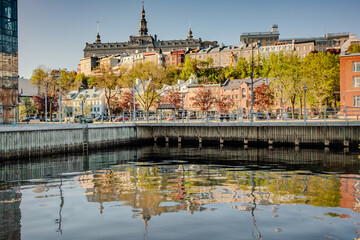 Fototapeta premium Old Quebec City Waterfront with Historic Buildings and Reflection in Autumn Canada