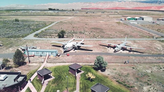 Aerial downward view of the air park with old aircrafts aligned. Airport terminal, airplanes, road. Travel concept