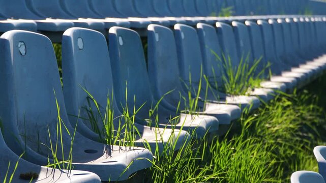 Rows of empty seats at outdoor sports arena