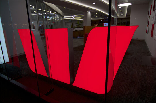 Illuminated Westpac Bank sign at building in Brisbane, Australia