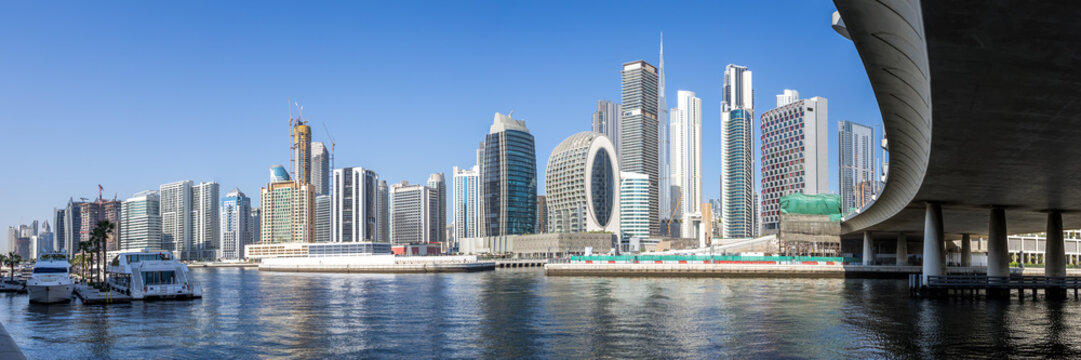 Downtown Dubai skyscrapers panorama with Burj Khalifa skyline at Marasi Bay Business Bay Canal