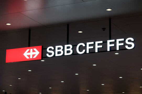 Illuminated SBB CFF FFS (Swiss Federal Railways company) sign at train station in Lugano, Switzerland