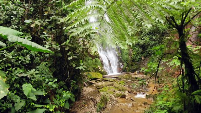 Waterfall at Junin, Imbabura province in Western Ecuador, within a critical mining concession with high biodiversity. drone shot