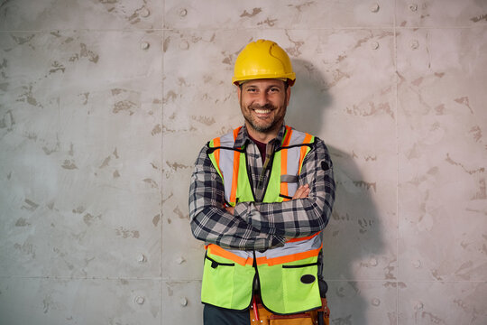 Portrait of confident construction site worker looking at camera.