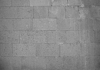 Fototapeta premium Front view of a wall made of gray slabs. background of a new and modern wall or building exterior grey slabs Marble brick pattern floor abstract natural marble black gray wall Top view and front view