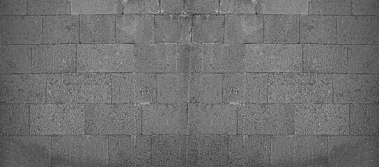 Front view of a wall made of gray slabs. background of a new and modern wall or building exterior grey slabs Marble brick pattern floor abstract natural marble black gray wall Top view and front view © Maxim Chuev