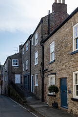 Fototapeta premium Stone cottages with blue door in Richmond, North Yorkshire, England