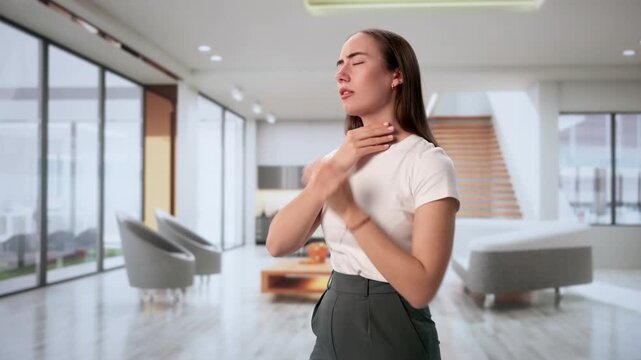 Woman Touching Swollen Gland In Throat Feeling Pain