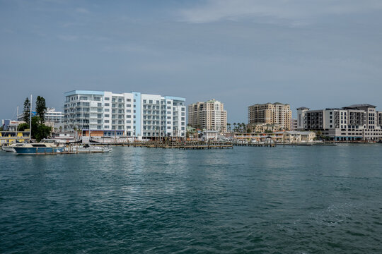 Clearwater Beach Florida Waterfront with Marina Boats and Coastal Residential Buildings Along Calm Gulf Waters