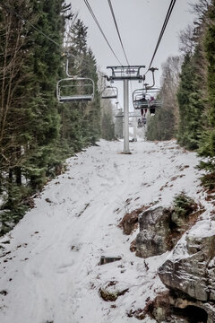 Snowshoe West Virginia Winter Mountain Resort with Ski Lift Snow Covered Slopes Frozen Lake and Low Visibility Weather Conditions